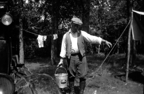 He could be carrying milk from the barn, but Carl F. Hanneman (1901-1982) is actually on a honeymoon camping trip in this July 1925 photo.