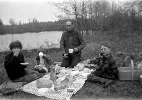 Walter Treutel picnics with children Nina, Elaine and Marvin, circa 1925. Behind the camera is Ruby (Treutel) Hanneman.