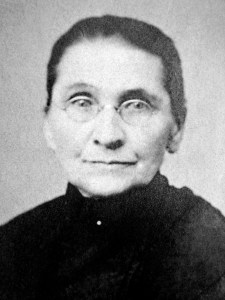 Cropped view of portrait of Henrietta (Krosch) Treutel (1838-1908). Henrietta Krosch came to America in July 1854 at age 16 from the town of Jessnitz, Saxony, Germany. Her family settled at Mukwonago, where her father, John Frederick Krosch, became a well-known farmer. She met and married blacksmith Philipp Treutel and lived the next 35 years in Mukwonago and North Prairie. Widowed in 1891, she moved her family to Vesper in Wood County in 1901, where she died on Feb. 6, 1908. She is buried at North Prairie Cemetery.