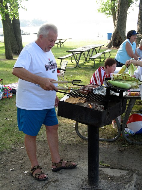 Ron in his favorite spot, working the grill.