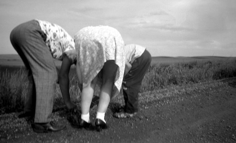 David and Lavonne Hanneman joined their mother Ruby in offering a rear-end salute to cameraman Carl F. Hanneman.
