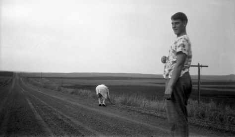 David D. Hanneman's priceless facial expression says it all, as his father Carl snaps yet another photo of mother Ruby picking up rocks.