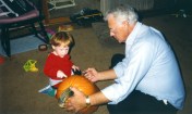 Son Stevie watches Grandpa Dave Hanneman prepare to carve, circa 1993.