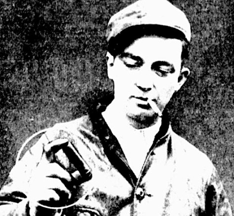 Railroad conductor George Kerwin holds an expended shotgun shell he found about 1 mile from the murder scene.
