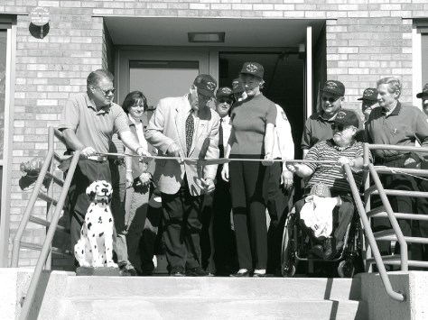Mayor Dave Hanneman cuts the ribbon at opening of the Sun Prairie fire station. (Sun Prairie Star Photo)