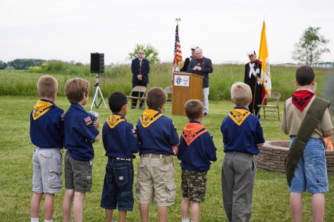 Boy Scouts participate in a flag retirement ceremony run by the Knights in Racine. Speaking at the podium is Deputy Grand Knight Joe Hanneman.