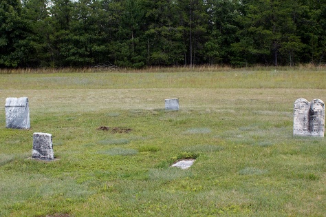The grave site of Matthias Hanneman is at left center, indicated by the partially excavated stone.