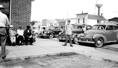 The uncropped version of the main photo shows David D. Hanneman in front of the Ortman Hotel in Canistota, South Dakota.